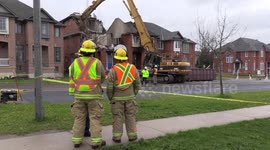 Crews search house explosion and fire scene for body of missing child in Markham Ontario Canada