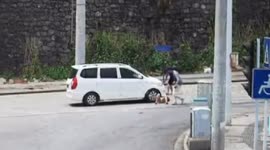 Minibus almost runs over woman who fell off mobility scooter in China