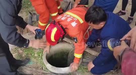 Chinese firefighter hangs upside down to rescue eight-year-old trapped in well