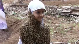 Eight-year-old girl covers herself with live bees to spread awareness on World Bee Day in southern India