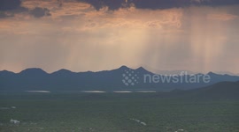 Rain Falling On Mountains