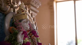 Flowers Draped Around Hanuman Statue