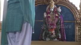 Hanuman Statue and Woman