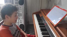 UK 8-year-old with cerebral palsy raises money for school with remarkable piano skills
