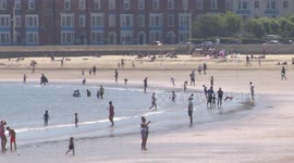 Britons flock to the beach on hottest day of the year