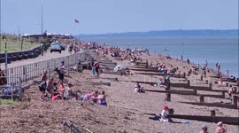 Britons crowd Kent beach during hottest day of the year