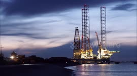 Prospector 1 drill rig illuminated at night in Sheerness, UK