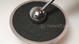 Incredibly satisfying ASMR moment black sand turns colorful