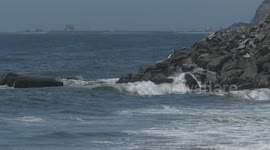 Waves Hitting Rocky Pier