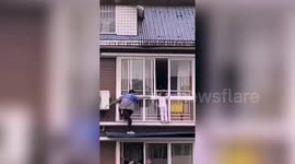 Chinese man climbs onto fifth floor to rescue six-year-old stranded on ledge