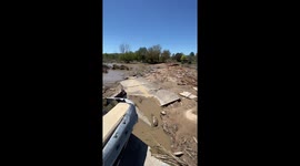 Dam failures and severe flooding cause bridge to partially collapse in Michigan