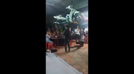Vietnamese street act balances 100-kilogram motorbike on her head in daring display