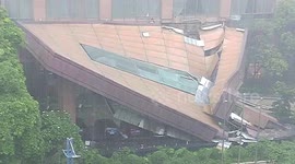 Hotel canopy collapses in China burying vehicles underneath debris