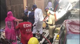 Crews extinguish fire, carry injured from crashed passenger plane wreckage in Karachi