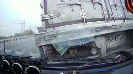 Thai truck driver causes double crash after 'reaching down to pick up items from centre console'
