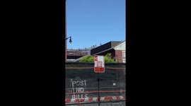 Men with orange bags go up Brooklyn bridge to suicidal man