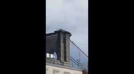 Suicidal man dangles leg off Brooklyn bridge