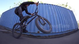 Young man does cool BMX Bike Wheelie trick in Slowmo / Action - Fun - Extreme Sports Video Clips