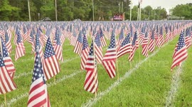 Thousands of U.S. flags laid out on school lawn to honor service members killed in Afghanistan and Iraq