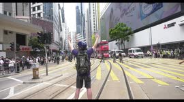 Lone Hong Kong protester faces off peacefully with riot police in the middle of Causeway Bay