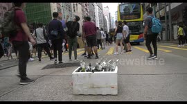 Protesters block Henessy road, then escape at the sight of the water canon