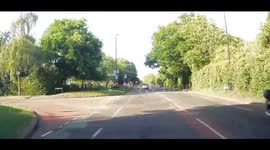 Bad driver drives through a red light, dash cam footage