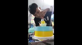 Vietnamese baker makes the chicken egg from cream on the cake