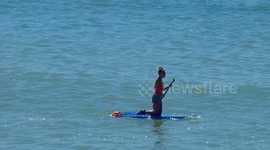 paddle boarding beautiful woman girl sunny day sea