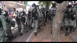 Hong Kong riot police push back crowd of protesters
