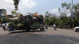 Mind-boggling video captures overpacked tricycle on road in Vietnam