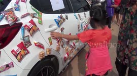 Thai couple attach snacks to car for locals to get during COVID-19 pandemic