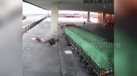 Tires knock over petrol station worker after coming loose from truck in China