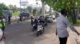 Indonesian police carry out checks on motorists and motorcyclists