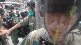 Hong Kong police brutally throw young journalist to the ground before pepper-spraying him