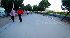 people take a walk during phase 1 of the coronavirus pandemic decline in the manzanares river park