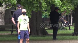 Toronto bylaw officers with ticket books in hand patrol Trinity Bellwoods park after social distancing circles are installed to keep people in compliance with strict physical distancing laws under the state of emergency due to COVID 19