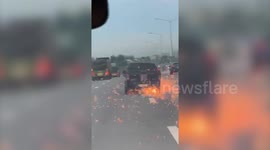 Sparks fly from pickup truck in high-speed police chase in Thailand