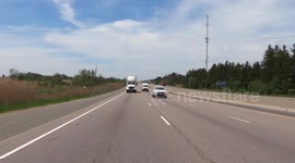 Transport trucks rolling down highway 401 in Ontario Canada as parts of the economy open up after COVID 19 lockdown