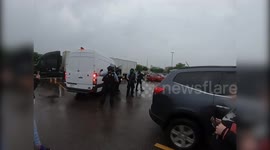 Riot police retreat as protesters surround them during clashes in Minneapolis