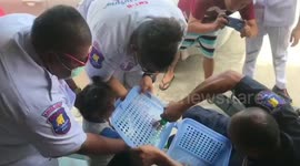 Curious toddler rescued after getting fingers stuck in plastic holes of laundry basket