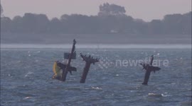 Wreck of SS Richard Montgomery in the Thames Estuary at sunset, UK