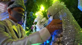 You may NOT kiss the bride! Couple weds in masks during pandemic