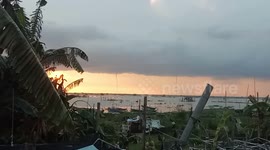 Rare triple waterspout forms in front of sunset in the Philippines