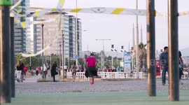 Cordoned off exercise area in barcelona and people running in the background, Barcelona Spain
