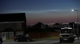Rare noctilucent clouds are illuminated above the nights sky in Dudley, West Midlands, UK