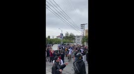Intense moment car drives through Los Angeles protesters rallying against police killing of George Floyd