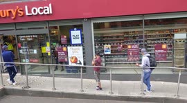 Corononavirus public queueing for groceries in London