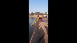 Crane plummets into river after attempting to rescue sinking vehicle in India