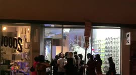 Moment Miami sneaker store looters flee in panic after 'man in passing car' fires shots