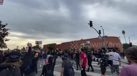 Angry mob of George Floyd Protestors near Erewan Grocery store in Los Angeles face off against the swat team and snipers